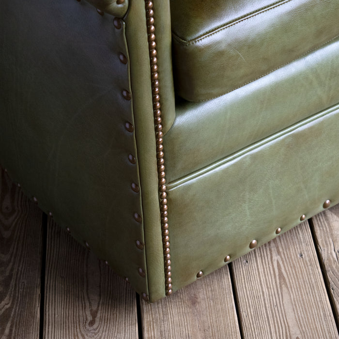 Rustic Green Leather Swivel Chair with Rolled Arms and Decorative Nailhead Trim