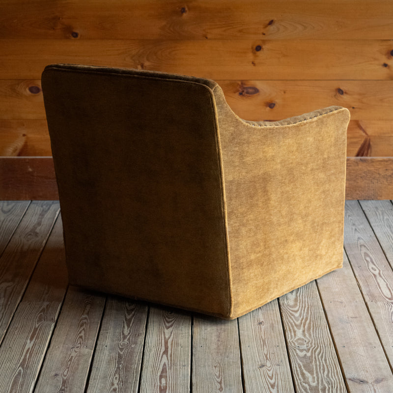 Sloped Arm Swivel Chair Upholstered in Brassy Umber Mohair Fabric with Tight Back and Nailhead Trim, Angled Back View