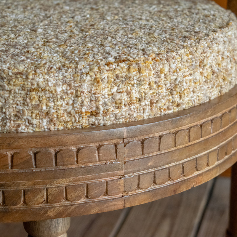 Close-up of the seat cushion of a sculptural accent chair inspired by an early 1900s Italian design