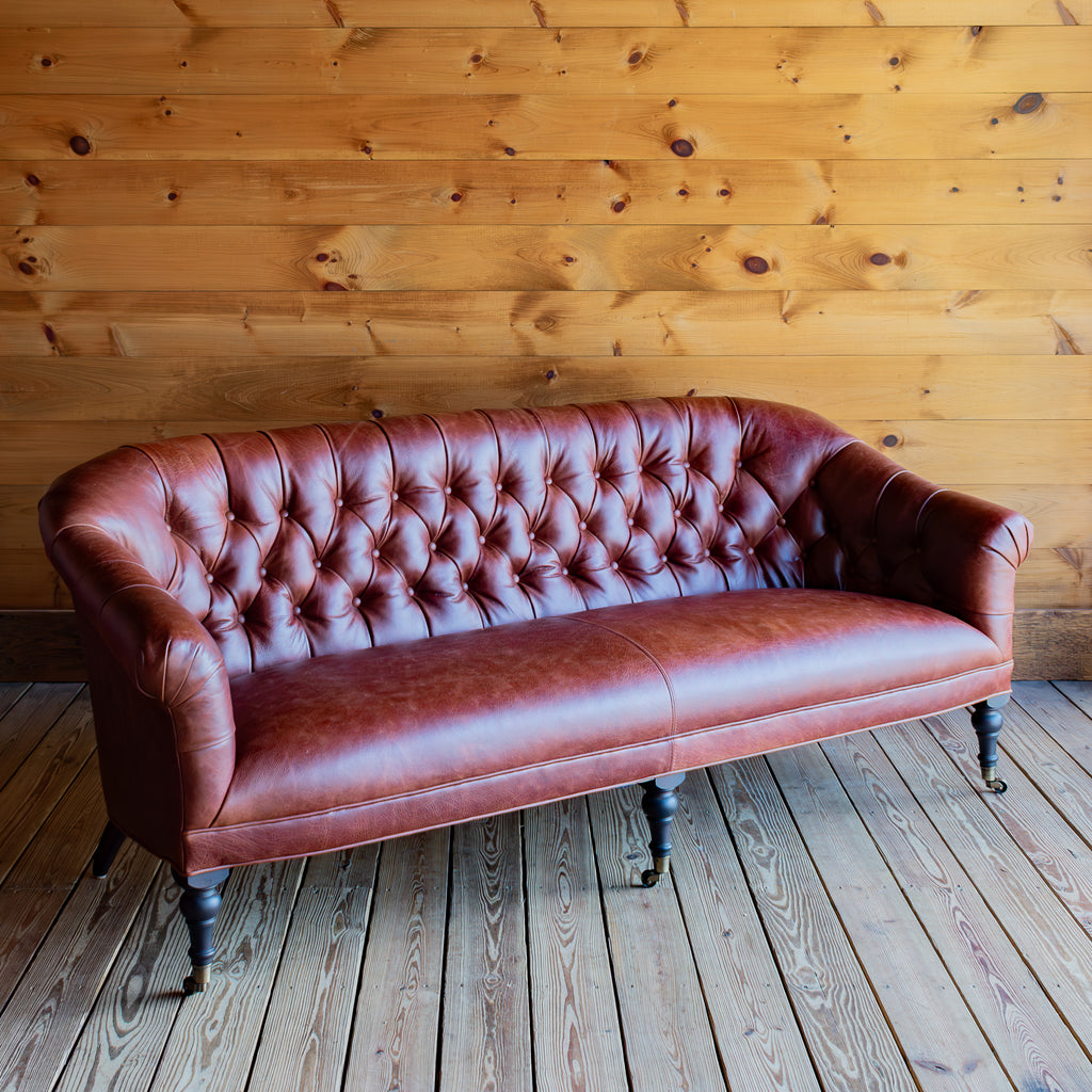 Pleated Arm Tufted Leather Sofa With Turned Legs