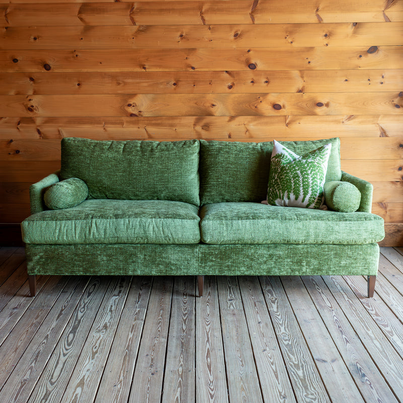 Plush Green Sofa With Roll Pillows, Front View with Fern Pillow