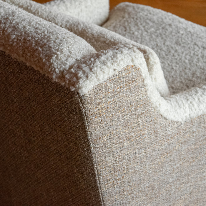 Close-up of the back corner of a tight back faux shearling chair