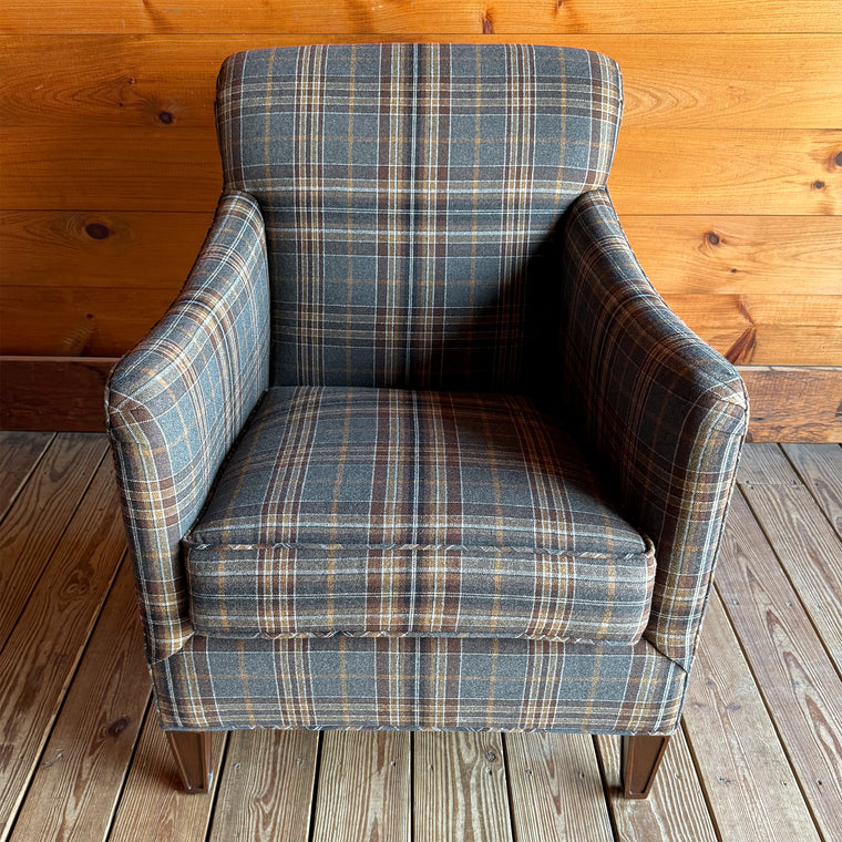 Close-up of classic steel blue, gold, and brown plaid fabric