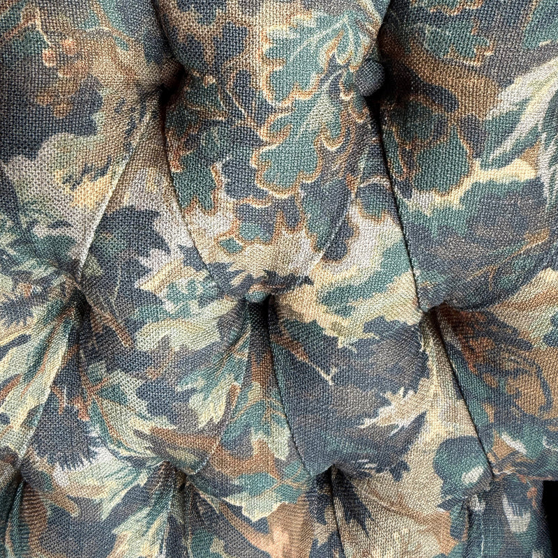 Close-up of vintage-inspired verdure tapestry fabric.