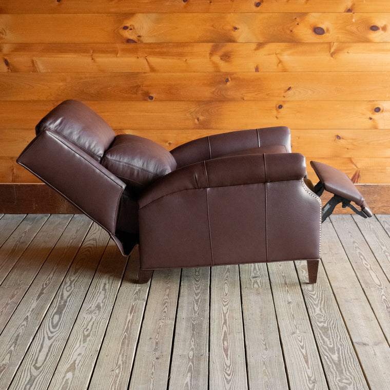 Leg close-up of a dark brown leather recliner
