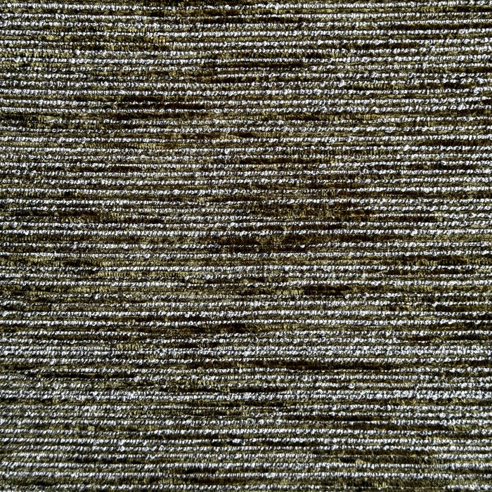 Close-up of a mottled moss green upholstery fabric