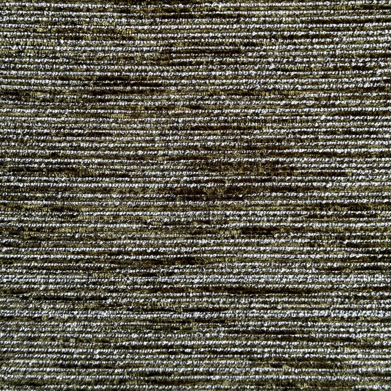 Close-up of a mottled moss green upholstery fabric
