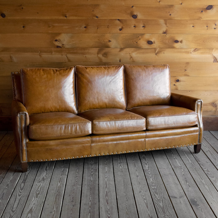 Three Seat Sofa Upholstered in Burnished Walnut Leather with Nailhead Trim and Down Seat and Back Cushions