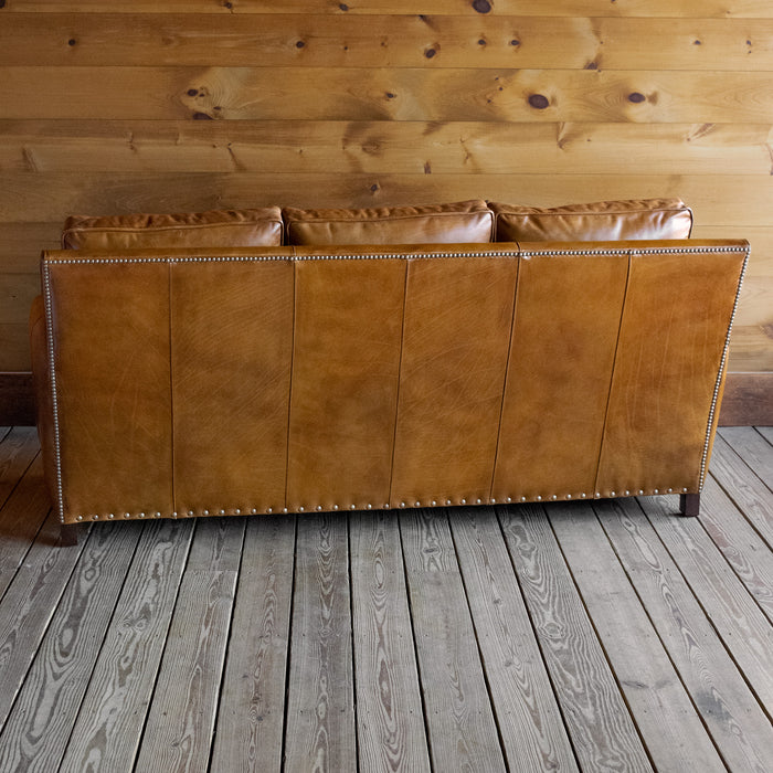 Three Seat Sofa Upholstered in Burnished Walnut Leather with Nailhead Trim and Down Seat and Back Cushions