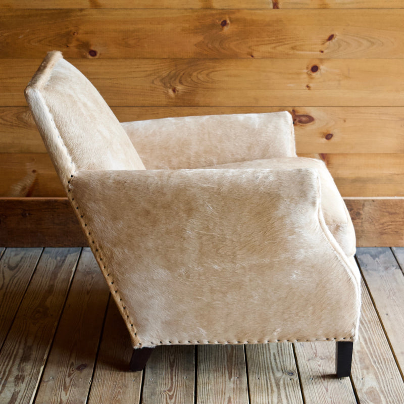 Cowhide Arm Chair with Cut Nail Trim and Wooden Legs
