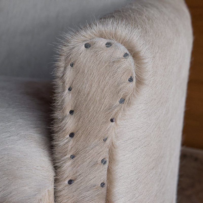 Rustic Arm Chair & Ottoman Upholstered in Cowhide Leather with Tack Trim