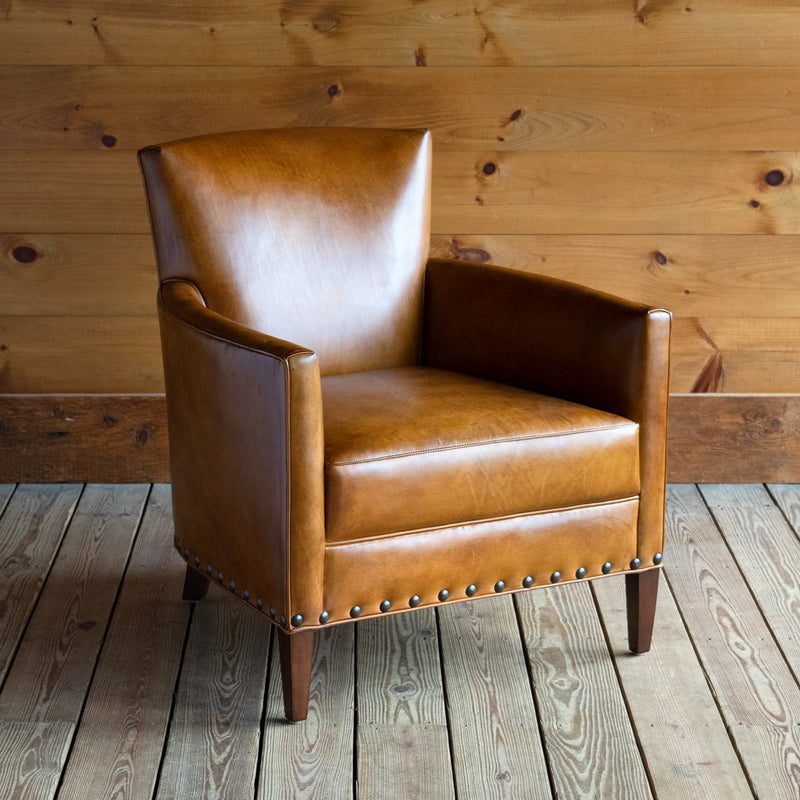 Curved Arm Chair Upholstered in Burnished Walnut Leather with Nailhead Trim