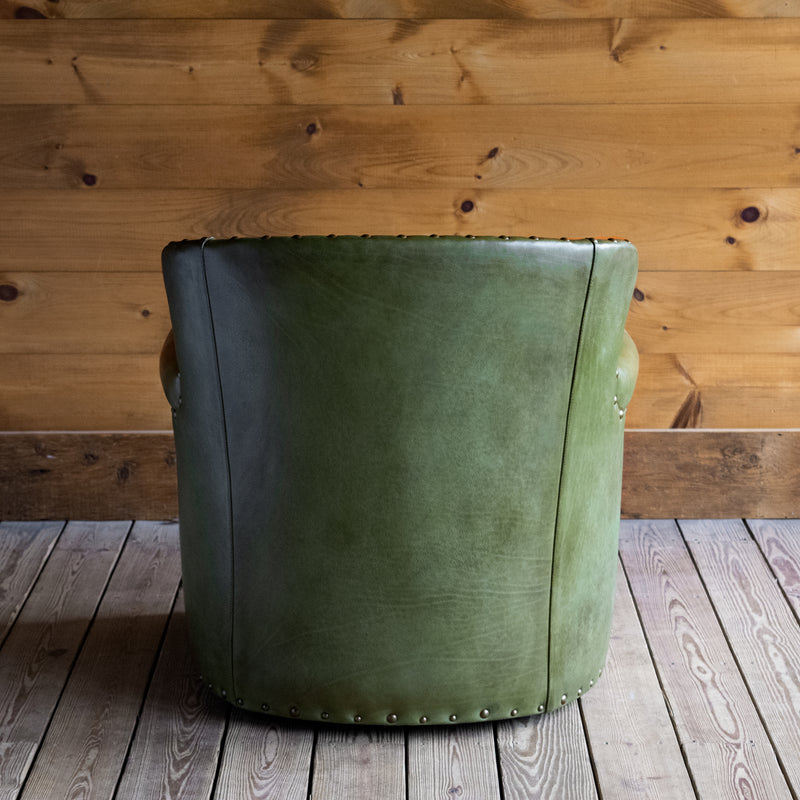 Rustic Green Leather Swivel Chair with Rolled Arms and Decorative Nailhead Trim